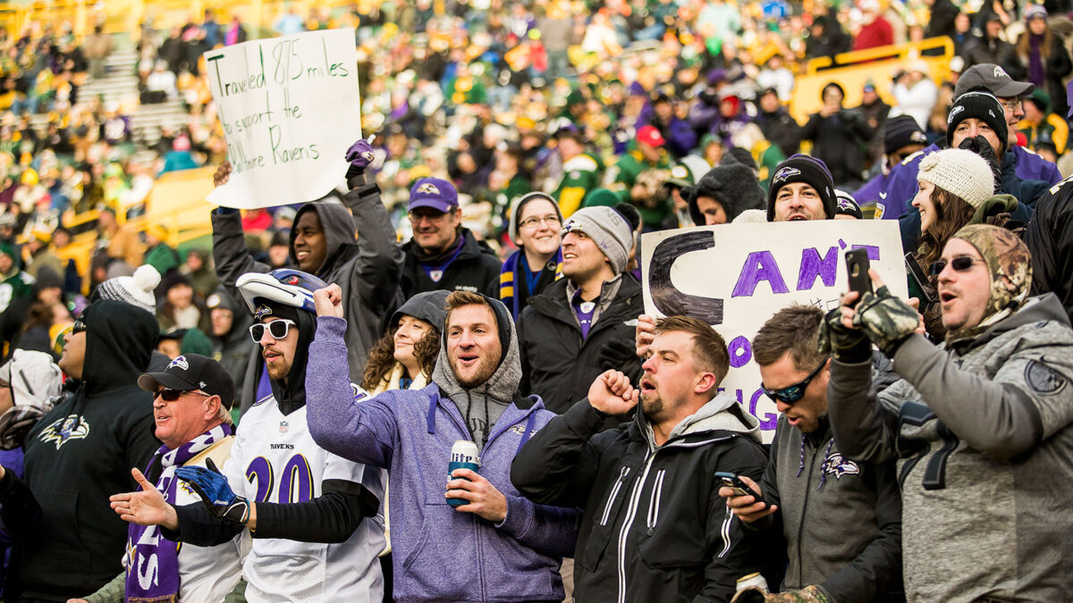 Group of fans celebrating with custom travel gear in Ohio